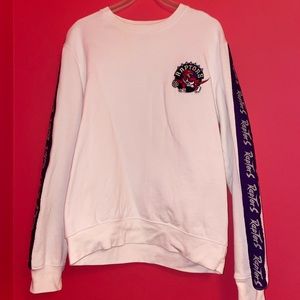 TORONTO RAPTORS WHITE CREWNECK WITH VINTAGE PURPLE RAPTORS ALONG SLEEVES MEDIUM
